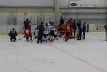 Photo of Oilers getting on ice direction from Coach McLellan