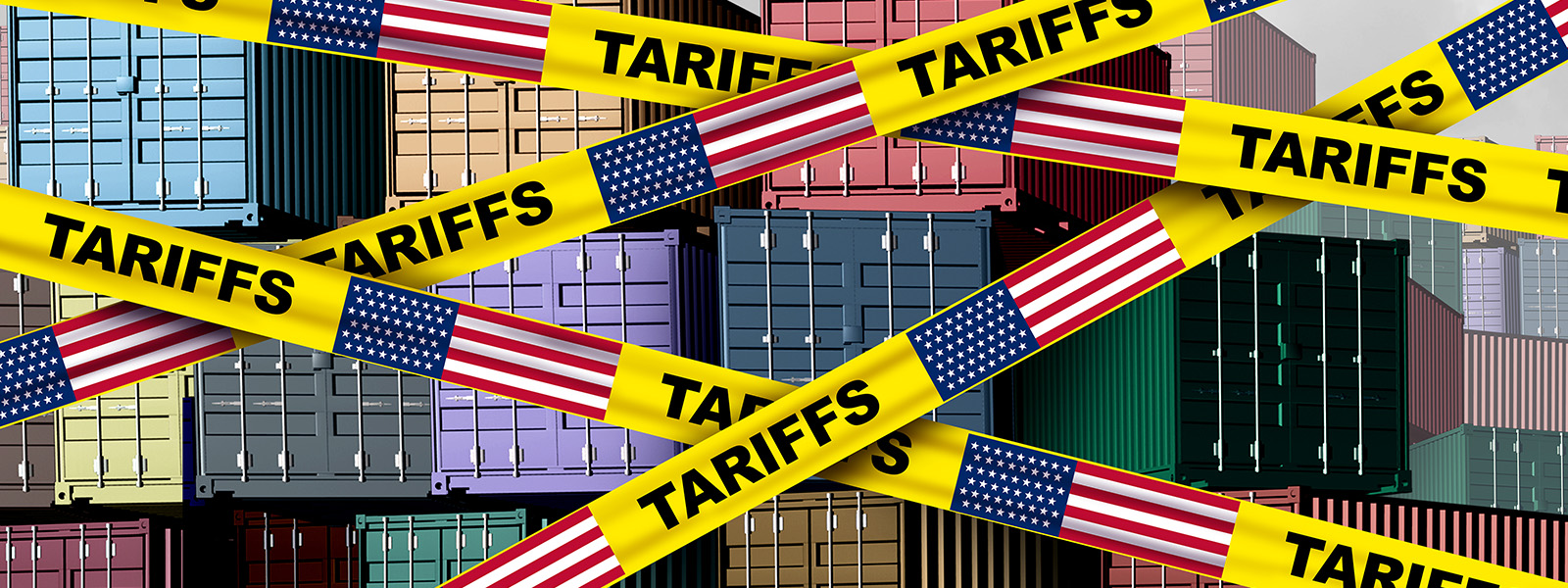 http://Stacks%20of%20shipping%20containers%20are%20obstructed%20by%20yellow%20tape%20labeled%20Tariffs%20with%20U.S.%20flags.