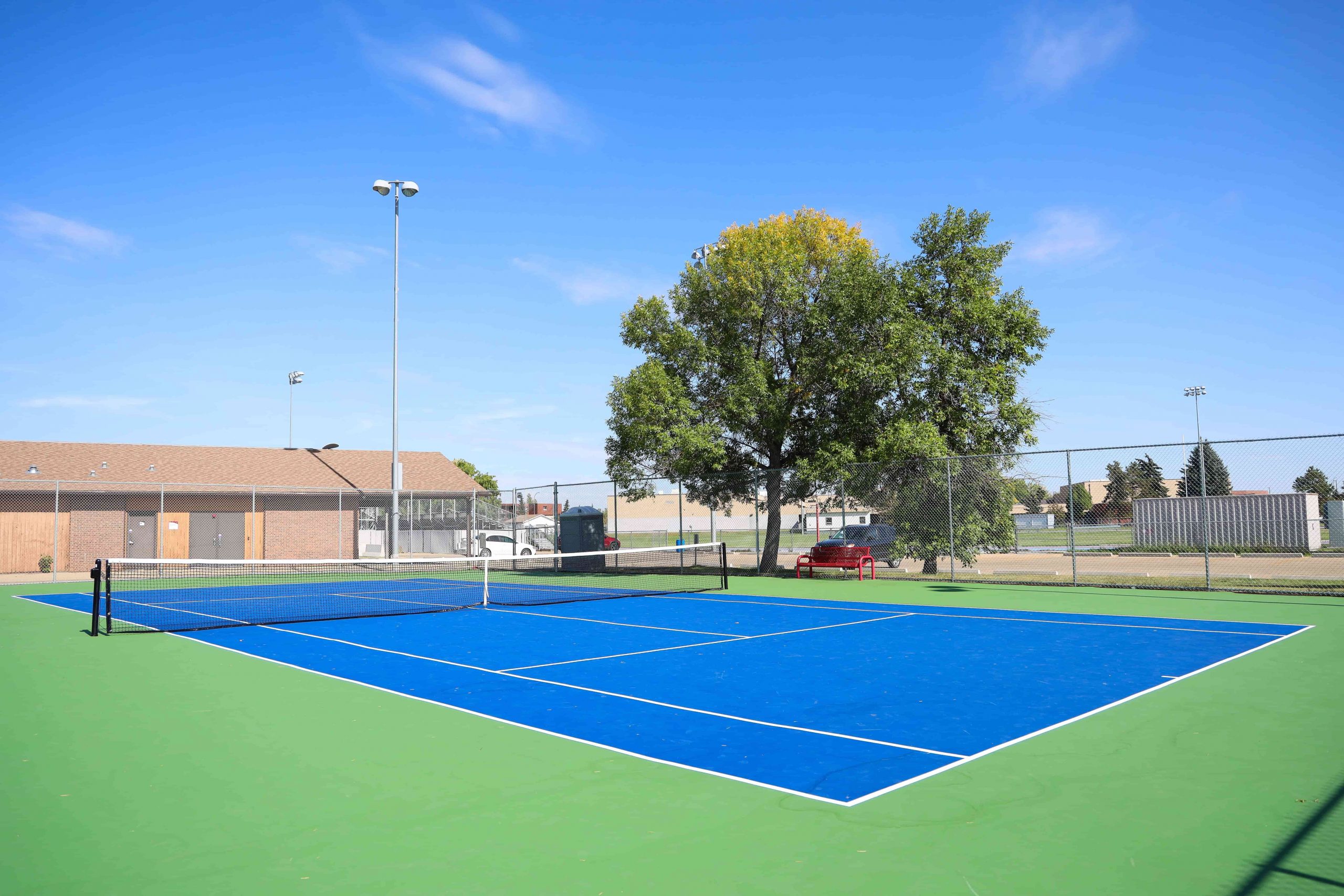 Leduc tennis court on a sunny day