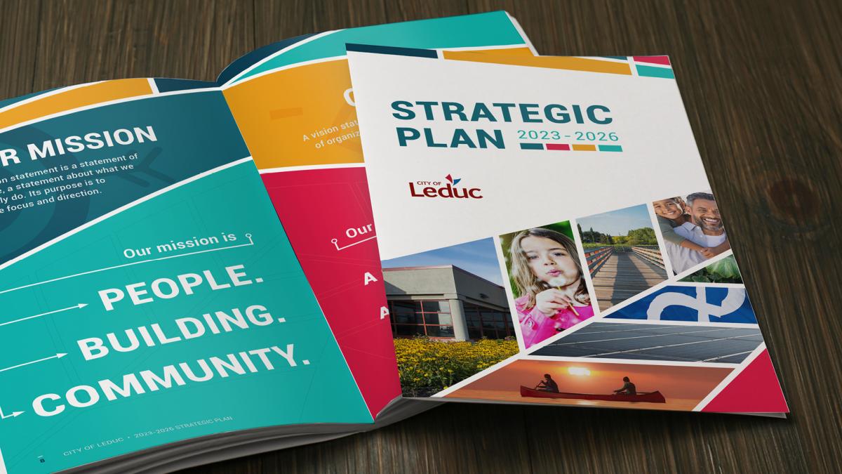 A brochure titled "Strategic Plan 2023-2026" with images of a building, child, family, and people rowing a boat.