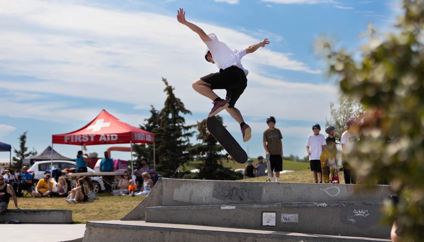 Young skateboarder doing tricks at Leduc's Skatepark