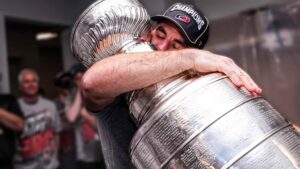 Jordan Martinook hugging the Stanley Cup